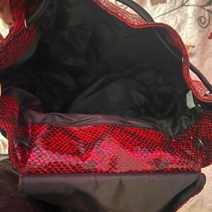 It’s a simple red bookbag that you are able to fit things to take out